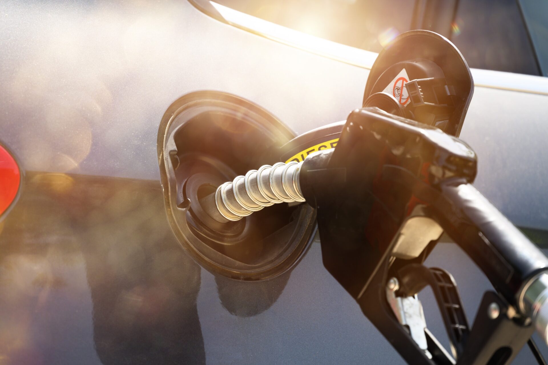 Fuel pump fill a tank of a car in a station Fuel pump fill a tank of a car in a station